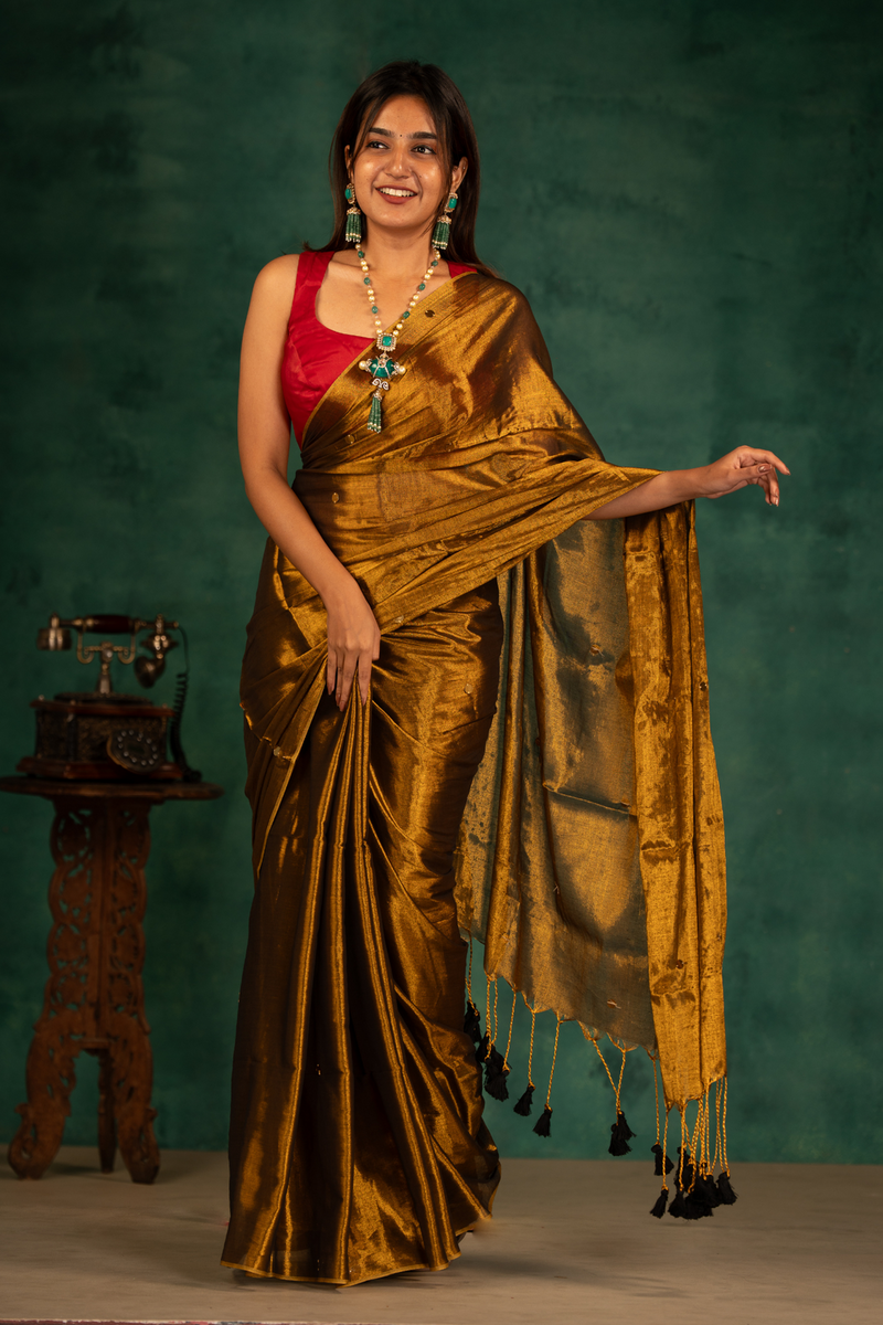 SAREEN Deep Antique Gold Gini Raga Cotton Tissue Saree with Elegant Tassels