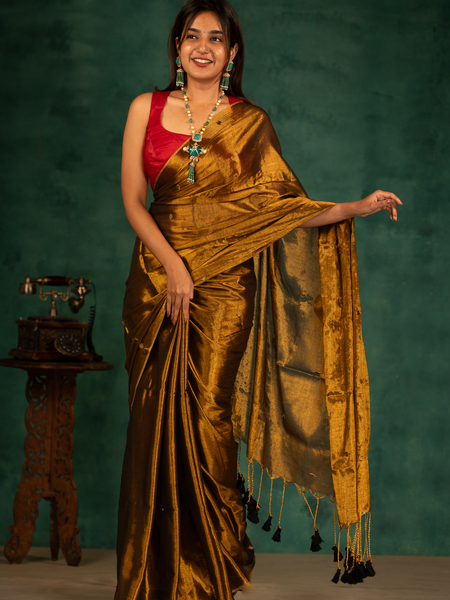 SAREEN Deep Antique Gold Gini Raga Cotton Tissue Saree with Elegant Tassels