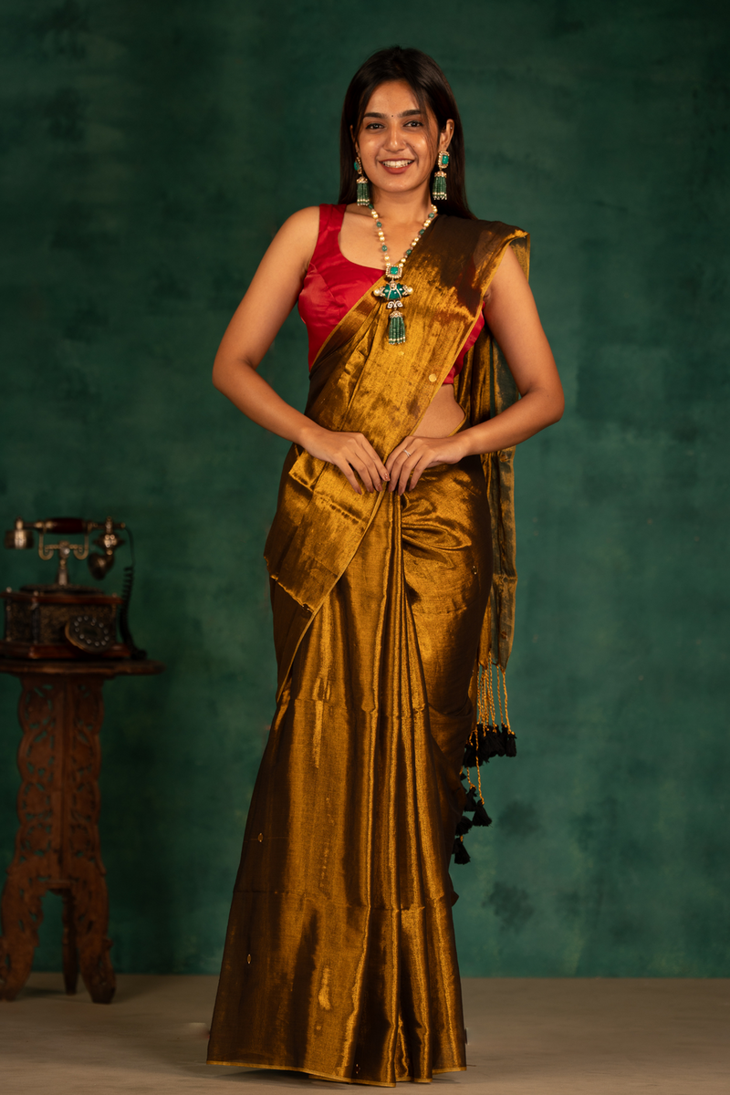 SAREEN Deep Antique Gold Gini Raga Cotton Tissue Saree with Elegant Tassels