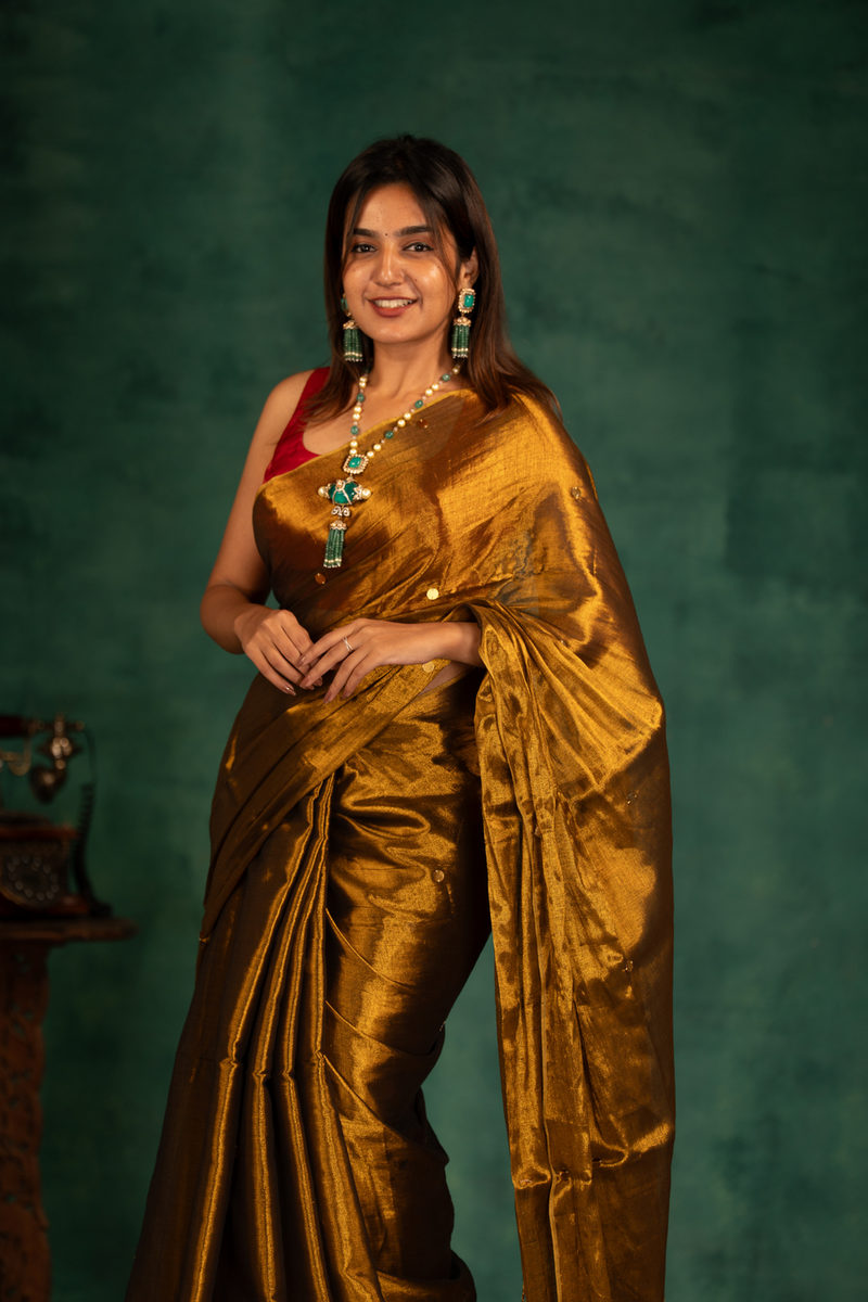 SAREEN Deep Antique Gold Gini Raga Cotton Tissue Saree with Elegant Tassels