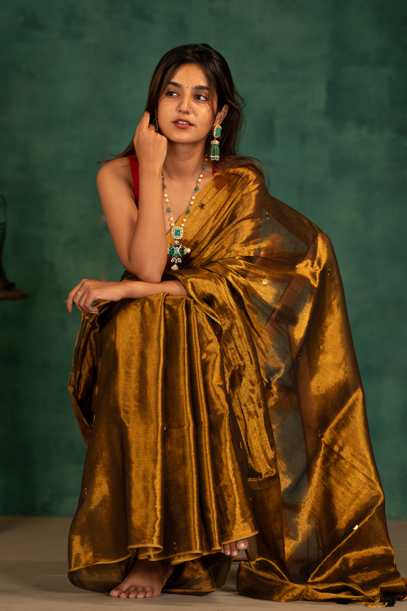 SAREEN Deep Antique Gold Gini Raga Cotton Tissue Saree with Elegant Tassels