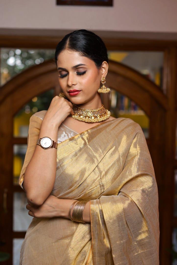 SAREEN Golden Beige Raga Tissue Saree with Subtle Zari Stripes & Tassel Pallu